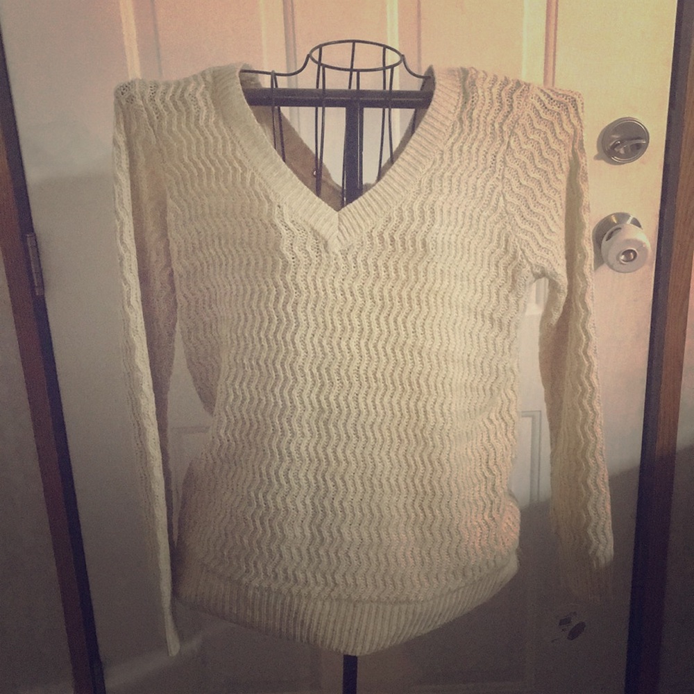 Beautiful sweater with lace up back.